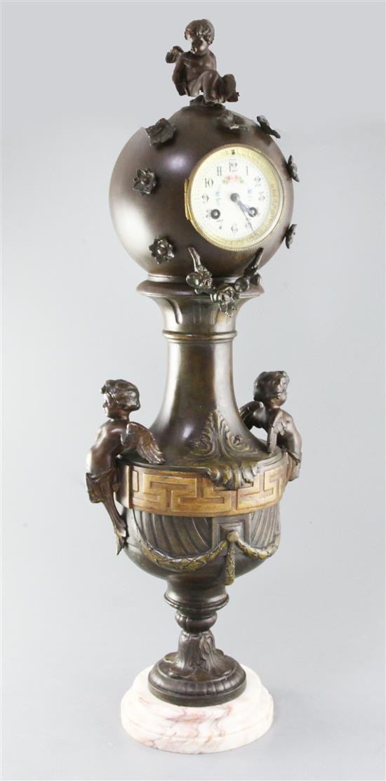 A 19th century French bronzed spelter mantel timepiece, 28in.